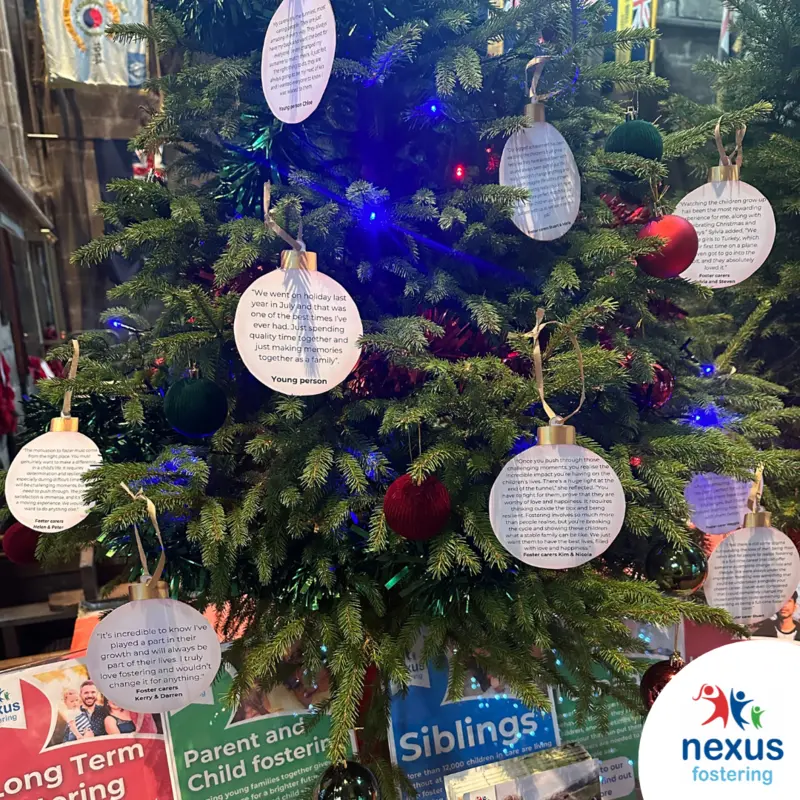 Decorating a Christmas tree for Nexus Fostering at St. Mary’s Church Christmas Tree Festival