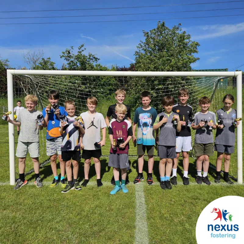 Stoke United FC U11 boys team celebrate with their trophies sponsored by Nexus Fostering