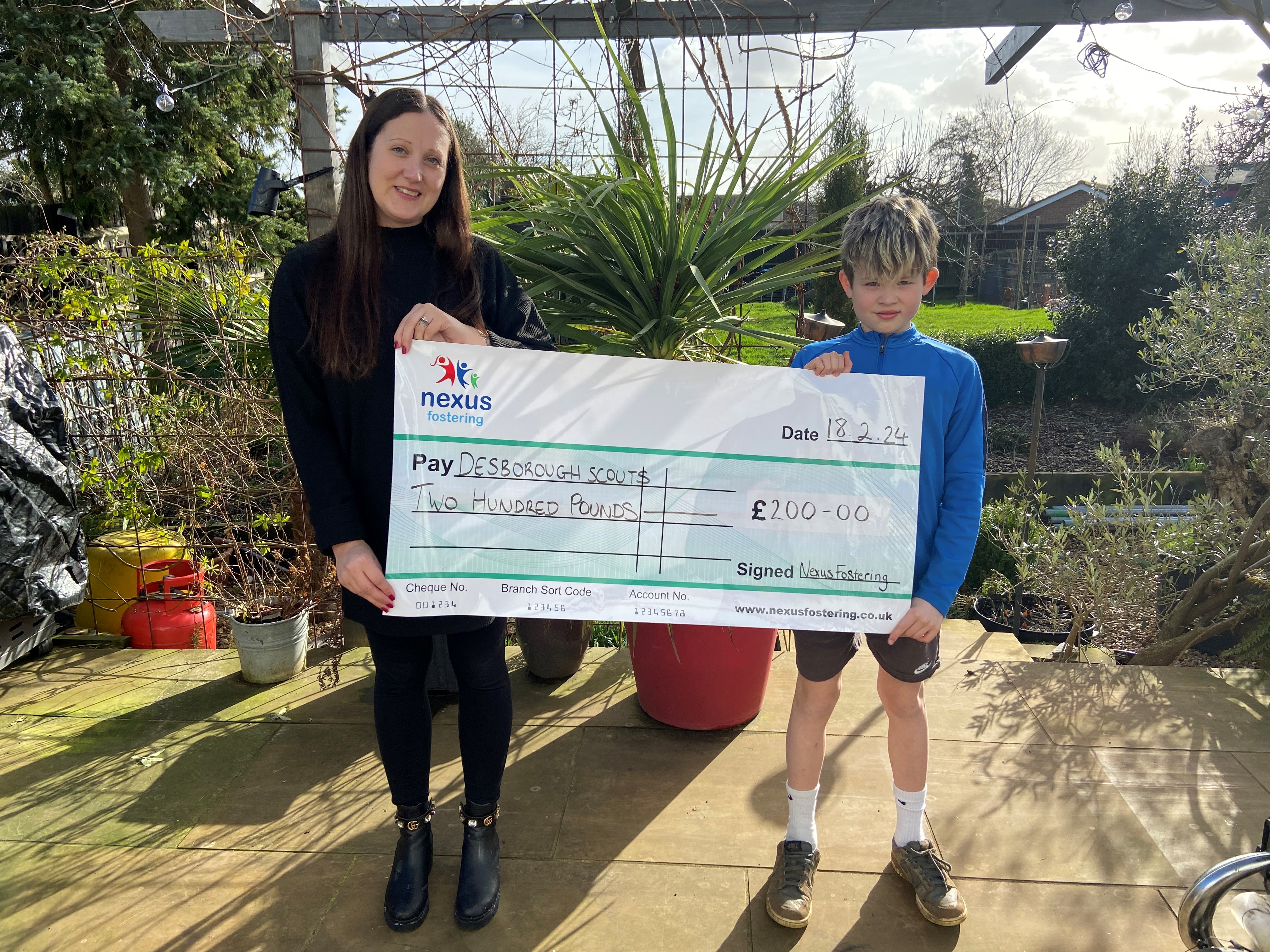 Kelly and son Austin receiving their donation
