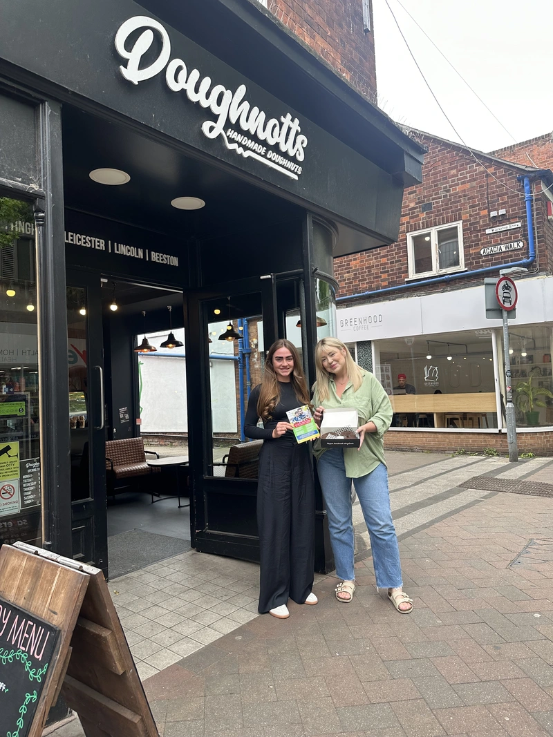 Megan from Nexus Fostering and Heidi from Doughnotts outside the store in Beeston